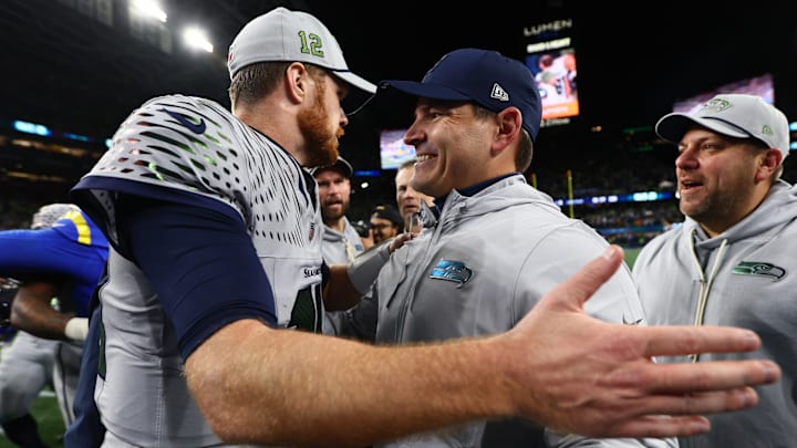 Dec 18, 2025; Seattle, Washington, USA; Seattle Seahawks head coach Mike MacDonald embraces quarterback Sam Darnold (14) after defeating the Los Angeles Rams in overtime at Lumen Field. Dec 18, 2025; Seattle, Washington, USA; Seattle Seahawks head coach Mike MacDonald embraces quarterback Sam Darnold (14) after defeating the Los Angeles Rams in overtime at Lumen Field.