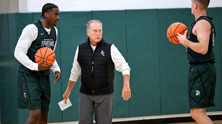 Michigan State's coach Tom Izzo, left, talks with Coen Carr, left, and Denham Wojcik during the first day of basketball practice on Monday, Sept. 22, 2025, at the Breslin Center in East Lansing.