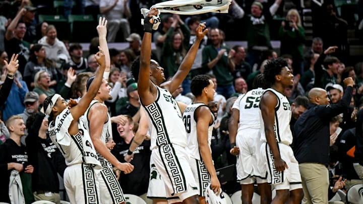 Michigan State's Cam Ward, center, and the rest of the team celebrate after the Walton's back-to-back 3-pointers against Toledo during the second half on Tuesday, Dec. 16, 2025, at the Breslin Center in East Lansing.