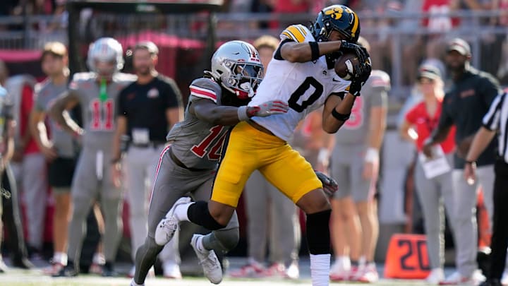 Oct 5, 2024; Columbus, OH, USA; Iowa Hawkeyes wide receiver Jarriett Buie (0) makes a catch against Ohio State Buckeyes cornerback Denzel Burke (10) in the second quarter during the NCAA football game at Ohio Stadium.