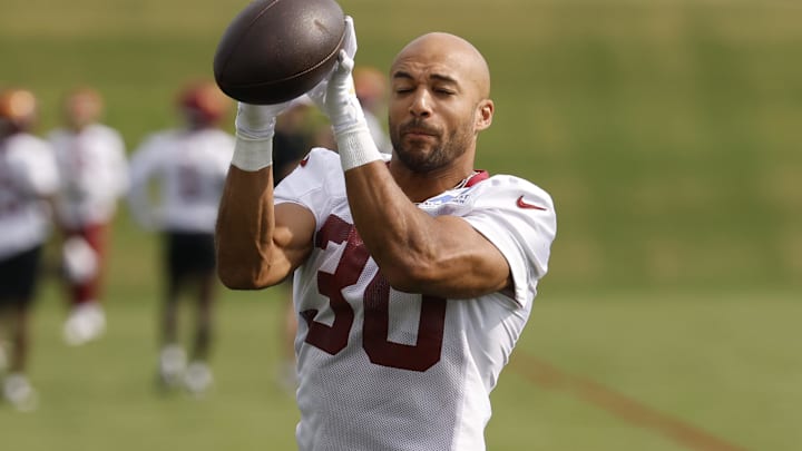 Jul 23, 2025; Ashburn, VA, USA; Washington Commanders running back Austin Ekeler (30) catches a ball during practice on day one of training camp at OrthoVirginia Training Center at Commanders Park. Mandatory Credit: Geoff Burke-Imagn Images Jul 23, 2025; Ashburn, VA, USA; Washington Commanders running back Austin Ekeler (30) catches a ball during practice on day one of training camp at OrthoVirginia Training Center at Commanders Park. Mandatory Credit: Geoff Burke-Imagn Images