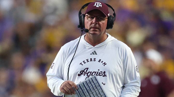Texas A&M Aggies head coach Mike Elko walks on the field during a time-out during the first quarter against the LSU Tigers at Tiger Stadium. Texas A&M Aggies head coach Mike Elko walks on the field during a time-out during the first quarter against the LSU Tigers at Tiger Stadium.