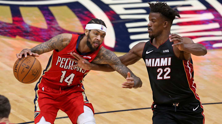 New Orleans Pelicans forward Brandon Ingram (14) is defended by Miami Heat forward Jimmy Butler (22) in the fourth quarter at the Smoothie King Center. Mandatory Credit: Chuck Cook-Imagn Images