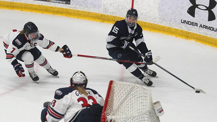 Penn State's Tessa Janecke (15) skates towards the net while being trailed by Robert Morris Colonials Wasyn Rice (7) on February 10, 2024 at Clearview Arena in Pittsburgh, PA.