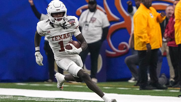 Texas Longhorns wide receiver Xavier Worthy (1) runs the ball during the Sugar Bowl College Football Playoff semifinals game against the Washington Huskies at the Caesars Superdome on Monday, Jan. 1, 2024 in New Orleans, Louisiana.