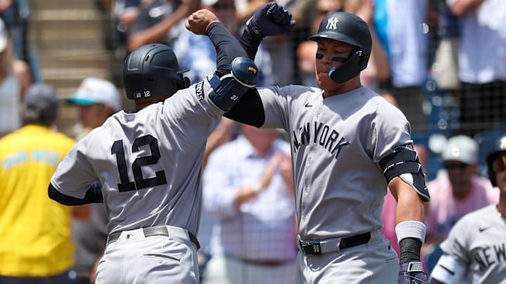 Apr 20, 2025; Tampa, Florida, USA; New York Yankees center fielder Trent Grisham (12) celebrates with designated hitter Aaron Judge (99) after hitting a home run against the Tampa Bay Rays in the first inning at George M. Steinbrenner Field.