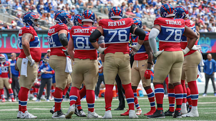 Sep 8, 2024; East Rutherford, New Jersey, USA; New York Giants offensive linemen huddle during the first quarter against the Minnesota Vikings at MetLife Stadium. Mandatory Credit: Vincent Carchietta-Imagn Images