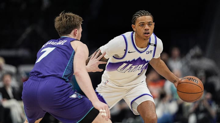 Nov 2, 2025; Charlotte, North Carolina, USA; Utah Jazz guard Keyonte George (3) handles the ball against Charlotte Hornets guard Kon Knueppel (7) during the second half at Spectrum Center. Mandatory Credit: Jim Dedmon-Imagn Images