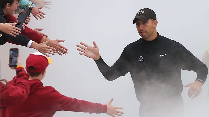 Iowa State Cyclones football head coach Matt Campbell high-fives fans as he takes the field before the game against Texas Tech at Jack Trice Stadium on Saturday, Nov. 2, 2024, in Ames, Iowa.