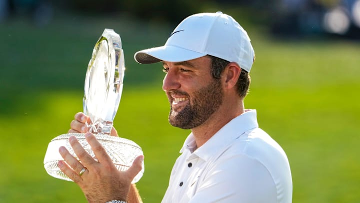 Scottie Scheffler holds the trophy on hole No. 18 after the final round of the Memorial Tournament at Muirfield Village Golf Course on Sunday, June 1, 2025 in Dublin, Ohio.