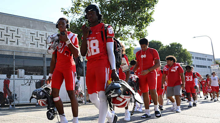Mater Dei football players arrive at the Santa Ana Bowl before their showdown with Bishop Gorman on Friday, Sept. 6, 2024.