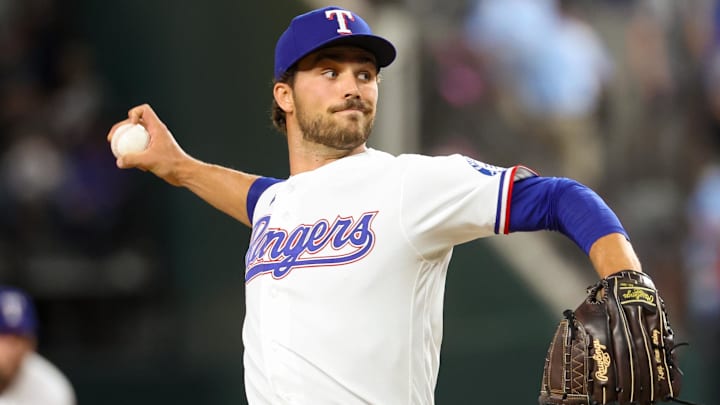 Texas Rangers pitcher Carter Baumler throws a baseball.