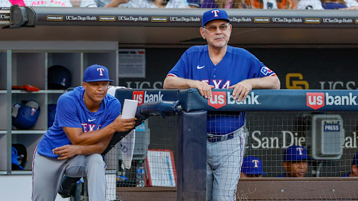 Jul 29, 2023; San Diego, California, USA; Texas Rangers manager Bruce Bochy (15) and associate manager Will Venable (83) watch on as San Diego Padres starting pitcher Yu Darvish (11) pitches during the fifth inning against the San Diego Padres at Petco Park.