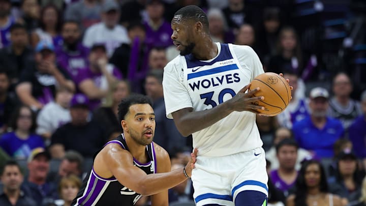 Minnesota Timberwolves forward Julius Randle (30) controls the ball against Sacramento Kings forward Trey Lyles during the second quarter at Golden 1 Center in Sacramento, Calif., on Oct, 24, 2024.