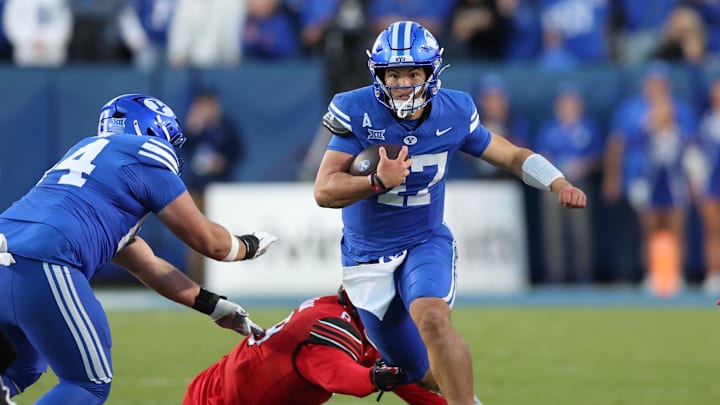 BYU Cougars quarterback Bear Bachmeier (47) runs against Utah Utes during the first quarter at LaVell Edwards Stadium.