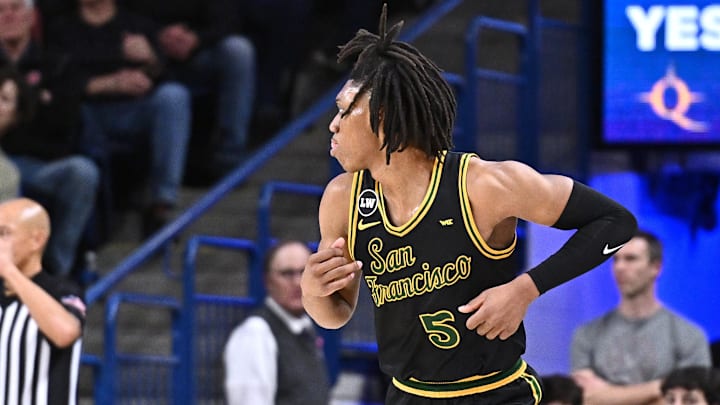 Jan 24, 2026; Spokane, Washington, USA; San Francisco Dons guard Tyrone Riley IV (5) celebrate a three-pointer against the Gonzaga Bulldogs in the first half at McCarthey Athletic Center. Mandatory Credit: James Snook-Imagn Images