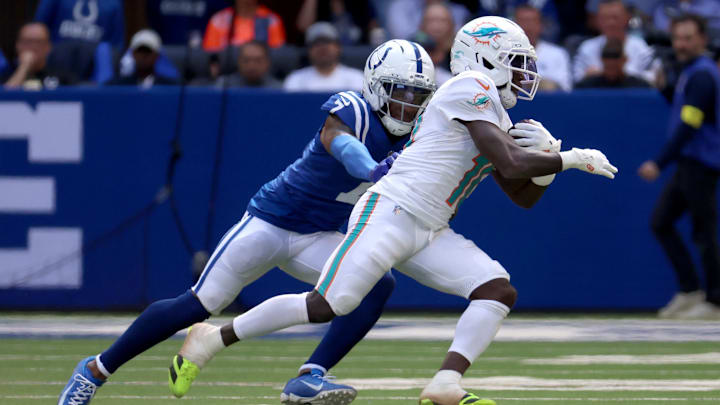 Miami Dolphins wide receiver Tyreek Hill (10) runs against Indianapolis Colts cornerback Charvarius Ward (7) during the second half at Lucas Oil Stadium.