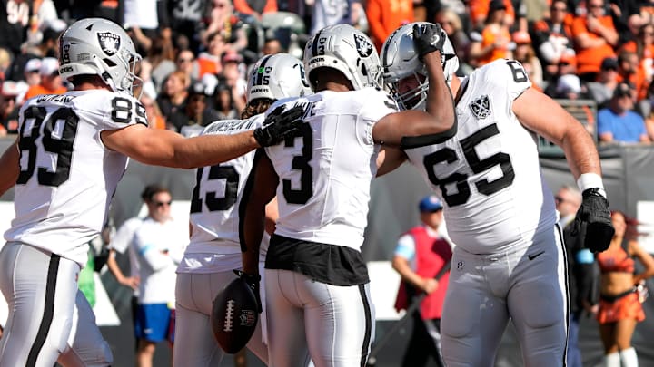 Las Vegas Raiders running back Zamir White (3) and his teammates celebrate White’s touchdown over the Cincinnati Bengals in the 1st quarter at Paycor Stadium Sunday, November 3, 2024. Las Vegas Raiders running back Zamir White (3) and his teammates celebrate White’s touchdown over the Cincinnati Bengals in the 1st quarter at Paycor Stadium Sunday, November 3, 2024.