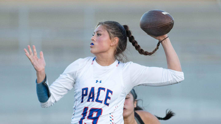 Quarterback Amaya Pablo (19) has her flag pulled before she could get off the pass during the Pace vs Navarre flag football game at Navarre High School on Tuesday, April 23, 2024.