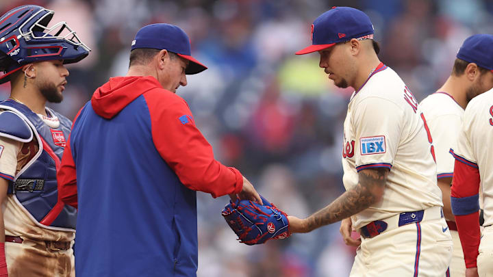 May 14, 2025; Philadelphia, Pennsylvania, USA; Philadelphia Phillies manager Rob Thomson hands the ball to pitcher Orion Kerkering  during the eighth inning against the St. Louis Cardinals at Citizens Bank Park.