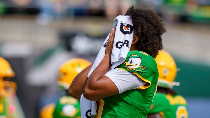 Oregon quarterback Dante Moore wipes off his face as the Oregon Ducks host the Boise State Broncos on Sept. 5, 2026, at Autzen Stadium in Eugene, Oregon.