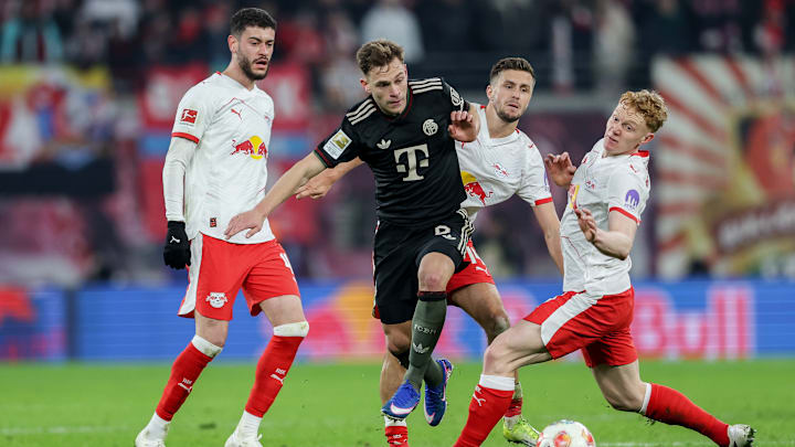 Romulo Cardoso of RB Leipzig (L), Joshua Kimmich of Bayern...