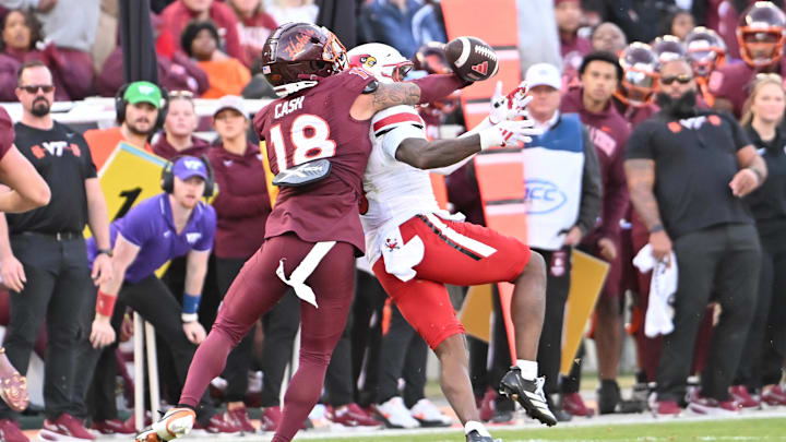 Nov 1, 2025; Blacksburg, Va.; Virginia Tech safety Isaiah Cash (18) bats away the ball.