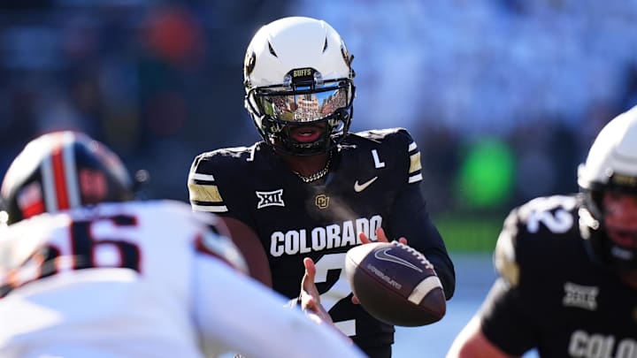Nov 29, 2024; Boulder, Colorado, USA; Colorado Buffaloes quarterback Shedeur Sanders (2) takes a hike in the first quarter against the Oklahoma State Cowboys at Folsom Field. Mandatory Credit: Ron Chenoy-Imagn Images
