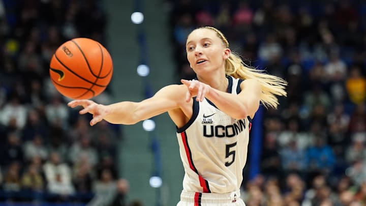 Dec 15, 2024; Storrs, Connecticut, USA; UConn Huskies guard Paige Bueckers (5) passes the ball against the Georgetown Hoyas in the first half at XL Center. Mandatory Credit: David Butler II-Imagn Images Dec 15, 2024; Storrs, Connecticut, USA; UConn Huskies guard Paige Bueckers (5) passes the ball against the Georgetown Hoyas in the first half at XL Center. Mandatory Credit: David Butler II-Imagn Images