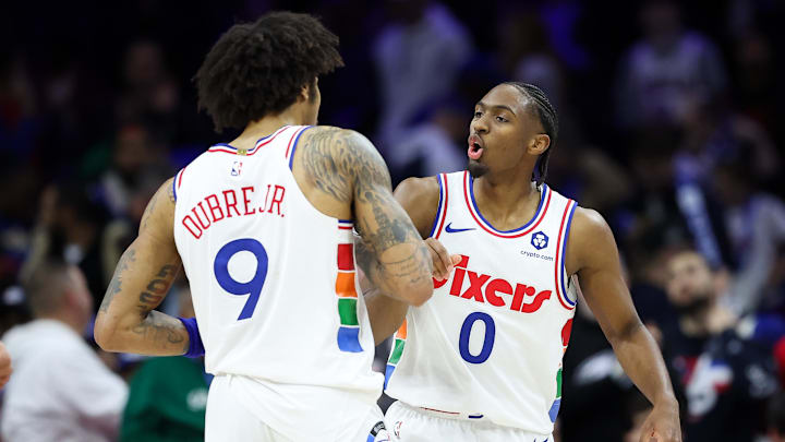 Jan 29, 2025; Philadelphia, Pennsylvania, USA; Philadelphia 76ers guard Tyrese Maxey (0) and guard Kelly Oubre Jr. (9) celebrate a victory against the Sacramento Kings at Wells Fargo Center. Mandatory Credit: Bill Streicher-Imagn Images