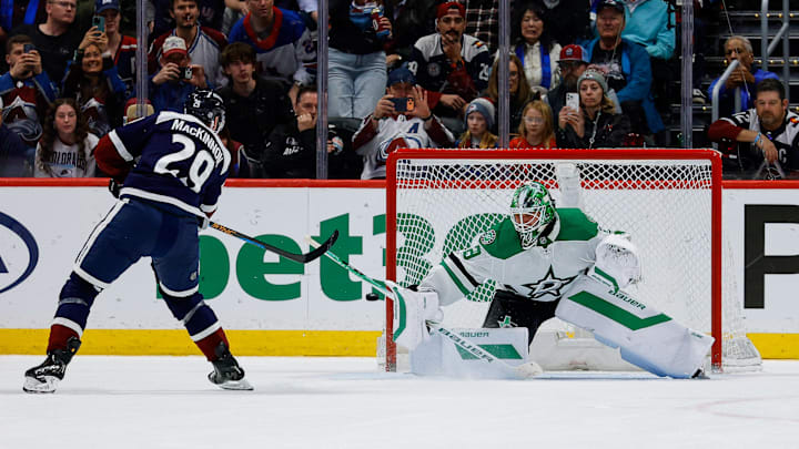Mar 18, 2026; Denver, Colorado, USA; Colorado Avalanche center Nathan MacKinnon (29) shoots the puck wide of the net against Dallas Stars goaltender Jake Oettinger (29) in the shootout at Ball Arena. Mandatory Credit: Isaiah J. Downing-Imagn Images Mar 18, 2026; Denver, Colorado, USA; Colorado Avalanche center Nathan MacKinnon (29) shoots the puck wide of the net against Dallas Stars goaltender Jake Oettinger (29) in the shootout at Ball Arena. Mandatory Credit: Isaiah J. Downing-Imagn Images