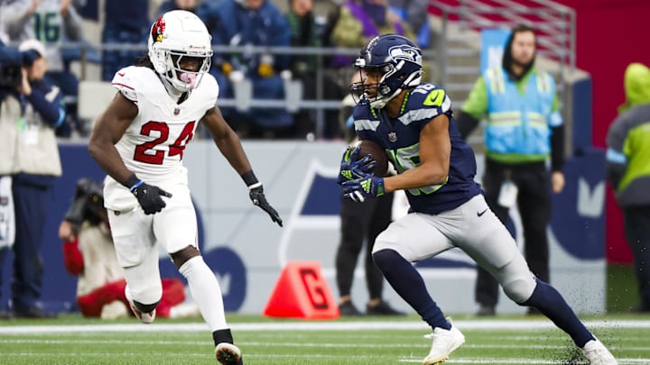 Nov 24, 2024; Seattle, Washington, USA; Seattle Seahawks wide receiver Tyler Lockett (16) runs for yards after the catch against Arizona Cardinals cornerback Starling Thomas V (24) during the third quarter at Lumen Field. 