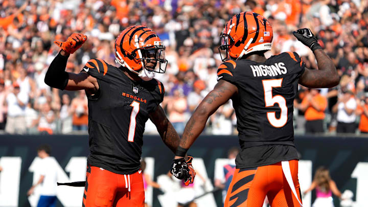 Cincinnati Bengals wide receiver Ja'Marr Chase (1) and wide receiver Tee Higgins (5) celebrate Higgins touchdown in the 3rd quarter over the Baltimore Ravens on Sunday, October 6, 2024, at Payor Stadium. Cincinnati Bengals wide receiver Ja'Marr Chase (1) and wide receiver Tee Higgins (5) celebrate Higgins touchdown in the 3rd quarter over the Baltimore Ravens on Sunday, October 6, 2024, at Payor Stadium.