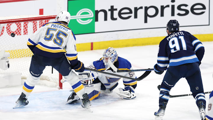 May 4, 2025; Winnipeg, Manitoba, CAN; Winnipeg Jets center Cole Perfetti (91) scores on St. Louis Blues goaltender Jordan Binnington (50) in the third period in game seven of the first round of the 2025 Stanley Cup Playoffs at Canada Life Centre. Mandatory Credit: James Carey Lauder-Imagn Images