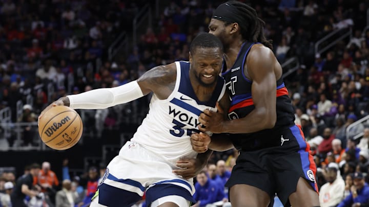 Jan 4, 2025; Detroit, Michigan, USA;  Minnesota Timberwolves forward Julius Randle (30) is defended by Detroit Pistons center Isaiah Stewart (28): Rick Osentoski-Imagn Images