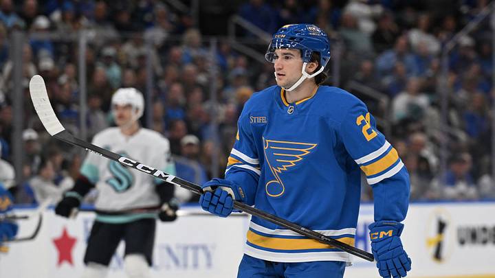Nov 8, 2025; St. Louis, Missouri, USA; St. Louis Blues right wing Jimmy Snuggerud (21) looks on during a game against the Seattle Kraken in the first period at Enterprise Center. Mandatory Credit: Joe Puetz-Imagn Images