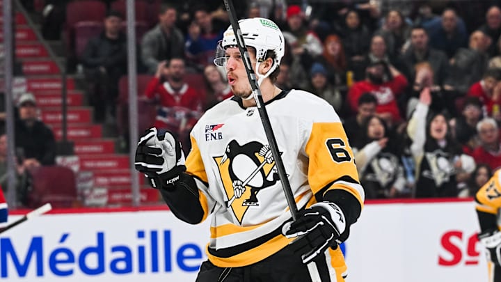 Dec 12, 2024; Montreal, Quebec, CAN; Pittsburgh Penguins right wing Rickard Rakell (67) reacts after scoring a goal against the Montreal Canadiens during the third period at Bell Centre. Mandatory Credit: David Kirouac-Imagn Images
