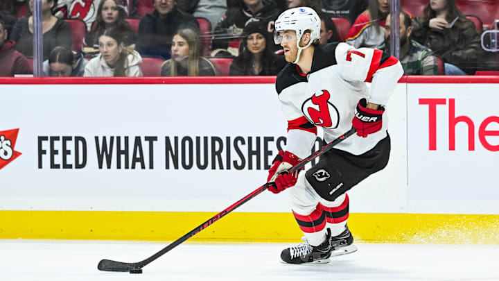 Jan 31, 2026; Ottawa, Ontario, CAN; New Jersey Devils defenseman Dougie Hamilton (7) plays the puck against the Ottawa Senators during the first period at Canadian Tire Centre. Mandatory Credit: David Kirouac-Imagn Images