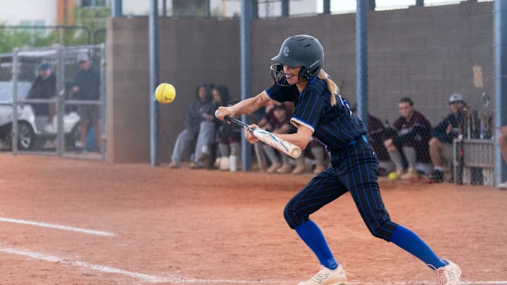 O'Connor Eagles Zoey Kuhl (2) bunts the ball against the Desert Mountain Wolves during a softball game at Sandra Day O'Connor High School in Phoenix, on April 4, 2025.