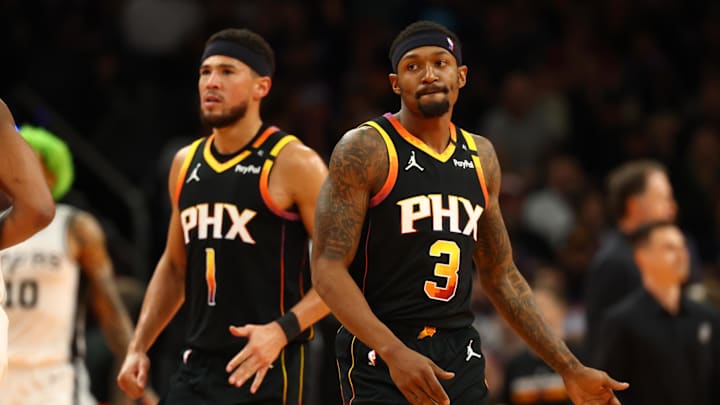Dec 3, 2024; Phoenix, Arizona, USA; Phoenix Suns guard Bradley Beal (3) and Devin Booker (1) against the San Antonio Spurs in the second half of an NBA Cup game at Footprint Center. Mandatory Credit: Mark J. Rebilas-Imagn Images Dec 3, 2024; Phoenix, Arizona, USA; Phoenix Suns guard Bradley Beal (3) and Devin Booker (1) against the San Antonio Spurs in the second half of an NBA Cup game at Footprint Center. Mandatory Credit: Mark J. Rebilas-Imagn Images