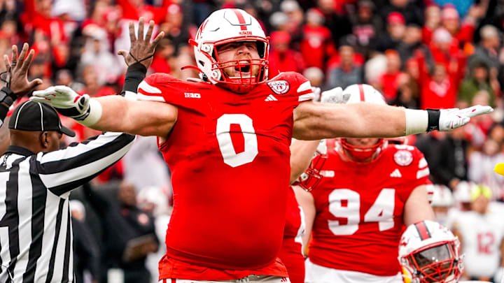 Nov 11, 2023; Lincoln, Nebraska, USA; Nebraska Cornhuskers defensive lineman Nash Hutmacher (0) celebrates after getting a stop on fourth down against the Maryland Terrapins during the third quarter at Memorial Stadium. Mandatory Credit: Dylan Widger-Imagn Images