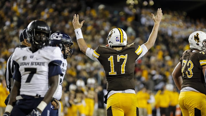 Nov 5, 2016; Laramie, WY, USA; Wyoming Cowboys quarterback Josh Allen (17) scores a touchdown against the Utah State Aggies during the second quarter at War Memorial Stadium.