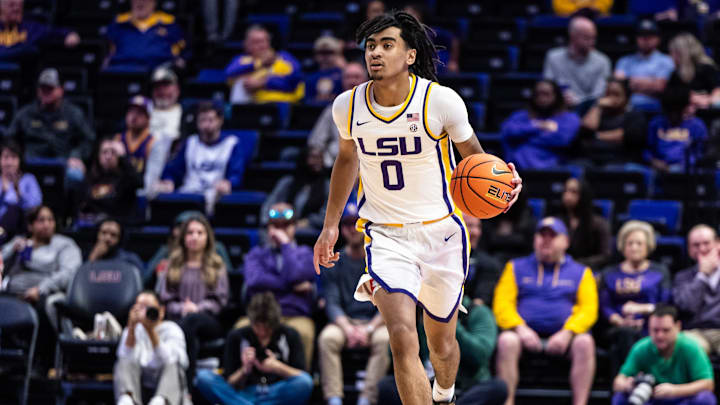 Feb 18, 2025; Baton Rouge, Louisiana, USA;  LSU Tigers guard Vyctorius Miller (0) dribbles against the South Carolina Gamecocks during the first half at Pete Maravich Assembly Center. Mandatory Credit: Stephen Lew-Imagn Images