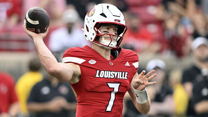 Sep 5, 2025; Louisville, Kentucky, USA;  Louisville Cardinals quarterback Miller Moss (7) looks to pass against the James Madison Dukes during the first half at L&N Federal Credit Union Stadium. Louisville defeated James Madison 28-14. Mandatory Credit: Jamie Rhodes-Imagn Images