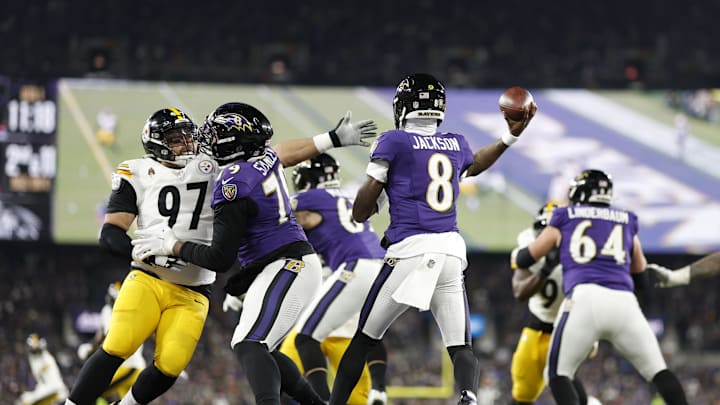 Jan 11, 2025; Baltimore, Maryland, USA; Baltimore Ravens quarterback Lamar Jackson (8) throws a pass against Pittsburgh Steelers defensive tackle Cameron Heyward (97) in the first quarter in an AFC wild card game at M&T Bank Stadium. Mandatory Credit: Geoff Burke-Imagn Images