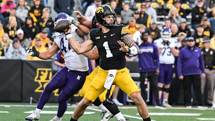 Oct 26, 2024; Iowa City, Iowa, USA; Iowa Hawkeyes quarterback Brendan Sullivan (1) throws a pass against the Northwestern Wildcats during the fourth quarter at Kinnick Stadium.