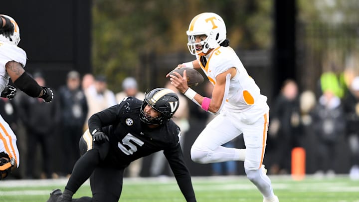 Nov 30, 2024; Nashville, Tennessee, USA; Tennessee Volunteers quarterback Nico Iamaleava (8) scrambles against the Vanderbilt Commodores during the second half at FirstBank Stadium. Mandatory Credit: Steve Roberts-Imagn Images Nov 30, 2024; Nashville, Tennessee, USA; Tennessee Volunteers quarterback Nico Iamaleava (8) scrambles against the Vanderbilt Commodores during the second half at FirstBank Stadium. Mandatory Credit: Steve Roberts-Imagn Images