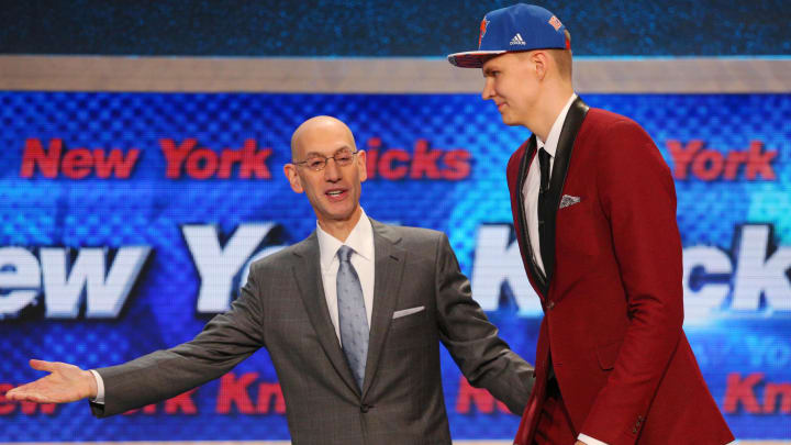 Jun 25, 2015; Brooklyn, NY, USA; Kristaps Porzingis is escorted onto the stage with NBA commissioner Adam Silver after being selected as the number four overall pick to the New York Knicks in the first round of the 2015 NBA Draft at Barclays Center. Mandatory Credit: Brad Penner-USA TODAY Sports