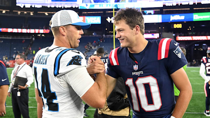 New England Patriots quarterback Drake Maye (10) high-fives Carolina Panthers long snapper JJ Jansen (44) after a game New England Patriots quarterback Drake Maye (10) high-fives Carolina Panthers long snapper JJ Jansen (44) after a game