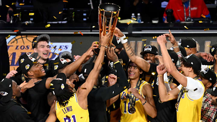 Dec 9, 2023; Las Vegas, Nevada, USA; Los Angeles Lakers players hoist the NBA Cup and celebrate after winning the NBA In-Season Tournament Championship game against the Indiana Pacers at T-Mobile Arena. Mandatory Credit: Candice Ward-Imagn Images Dec 9, 2023; Las Vegas, Nevada, USA; Los Angeles Lakers players hoist the NBA Cup and celebrate after winning the NBA In-Season Tournament Championship game against the Indiana Pacers at T-Mobile Arena. Mandatory Credit: Candice Ward-Imagn Images